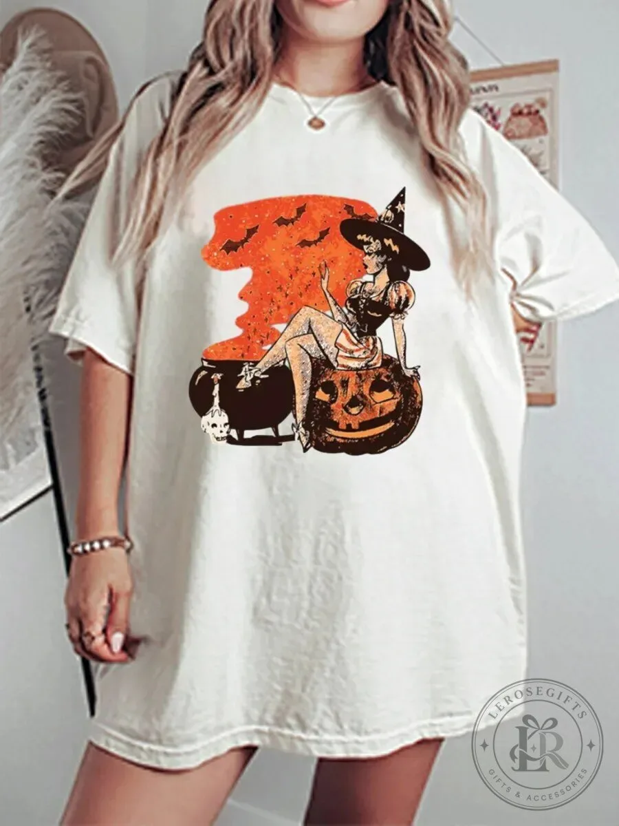 Halloween Graphic Tee Vintage Witch Sitting on Pumpkin Cauldron